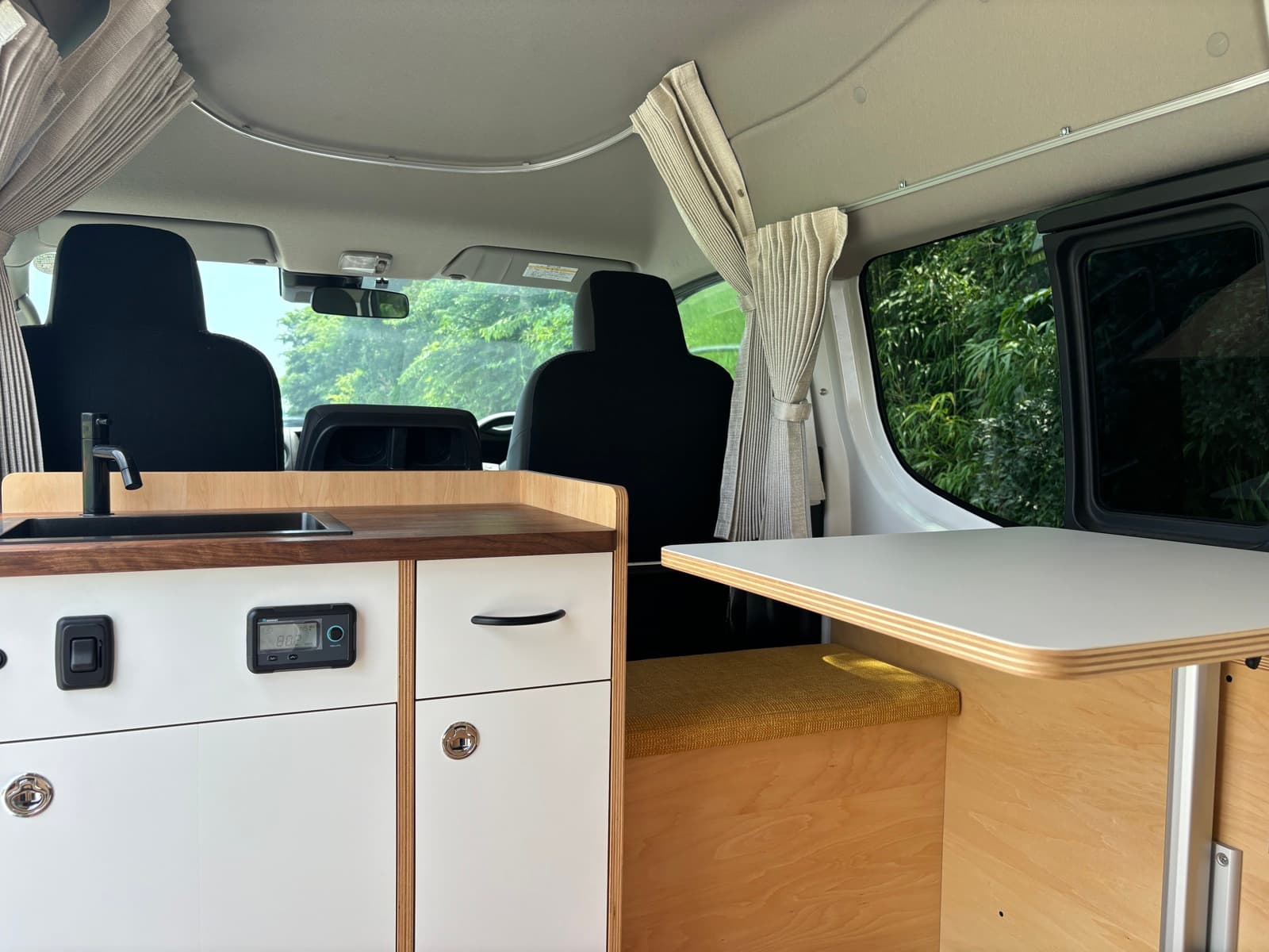 MANA kitchen and table looking forward